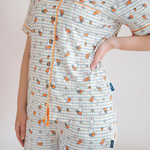 Woman wearing the Ladies Miffy Checkered Bloom bamboo pyjama set