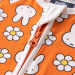 Two-way zip detail on the ZIPSTER x Miffy Daisy Days bamboo babygrow